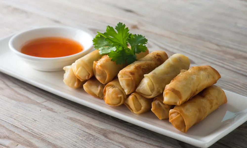 Crispy fried spring rolls with sweet chili dipping sauce at Oriental Express, a Chinese Restaurant in Denville