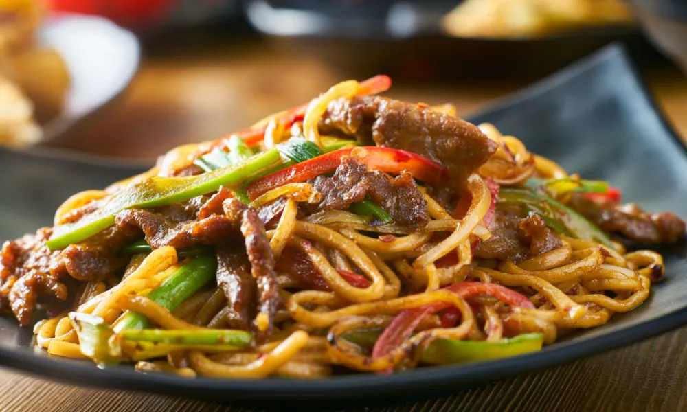 Beef stir-fried noodles with bell peppers, onions, and savory sauce at Oriental Express, a Chinese Restaurant in Denville